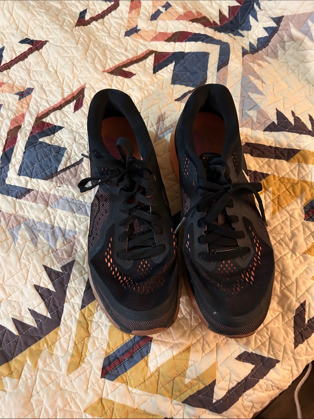 Black Running Shoes with Orange Accents